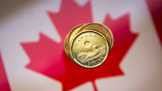 **Canadian dollar dips below 70 cents …