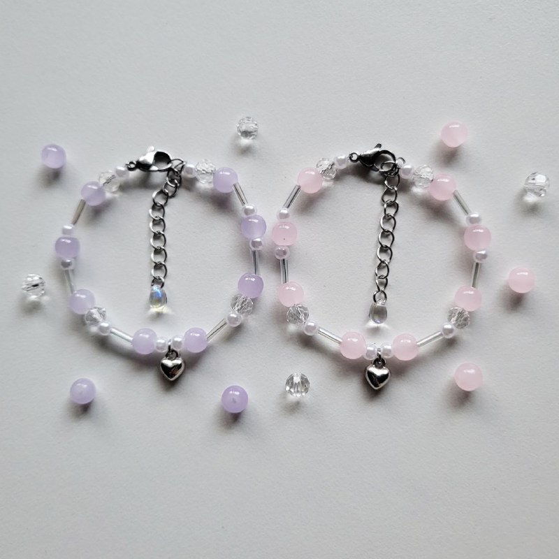 Heart bracelets in pink and purple …