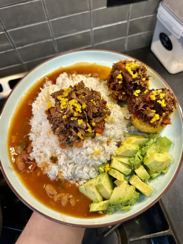 Pulled pork, avocado, tostones, rice and …