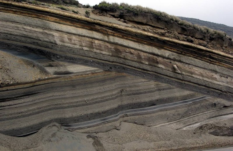 An erosional unconformity cutting diagonally across …