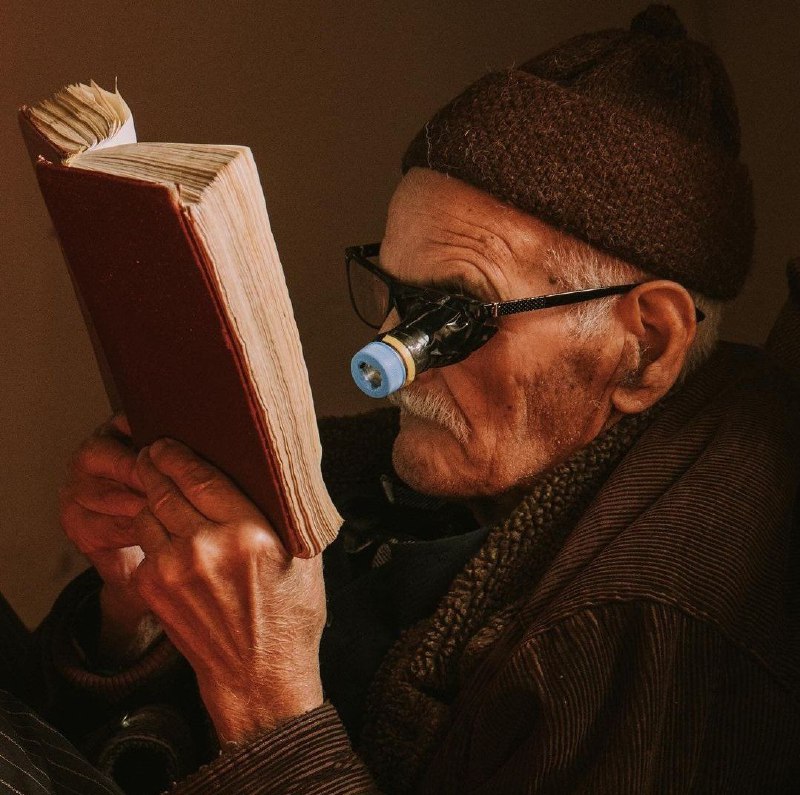 Old Albanian man reading the Holy …