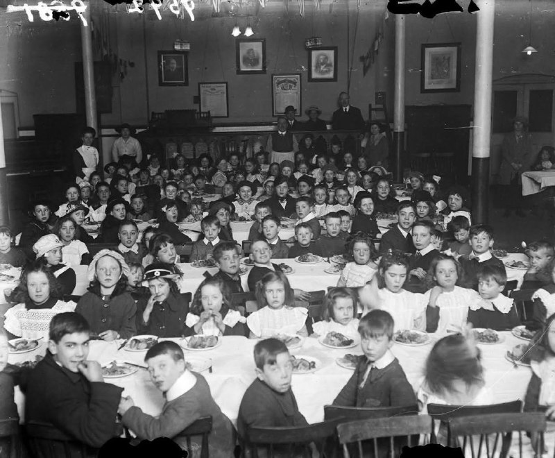 Tables crowded with children at a …