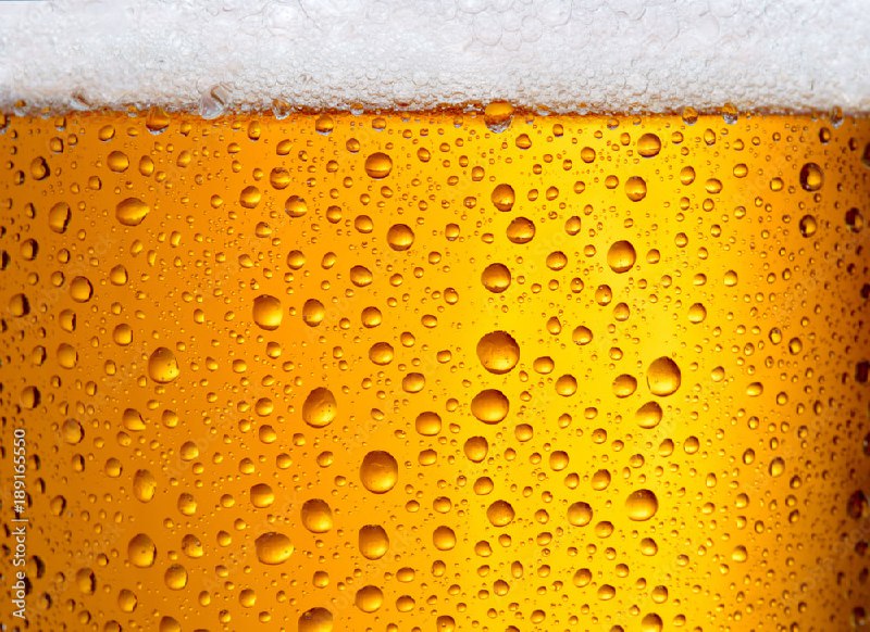 Close-up view of glass of beer …