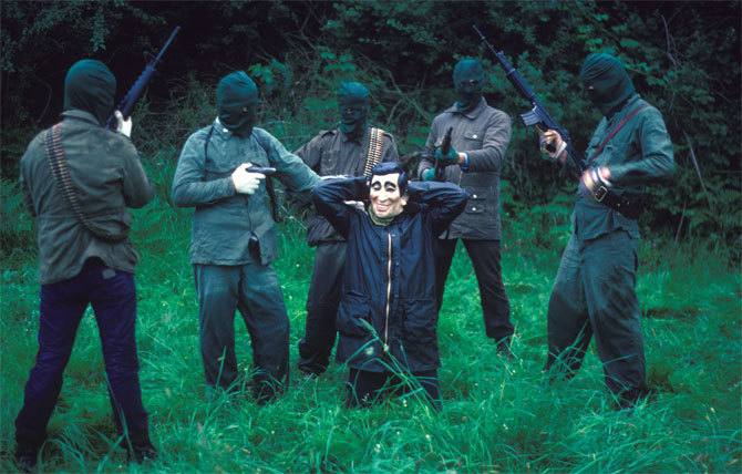 IRA soldiers posing with a captured …