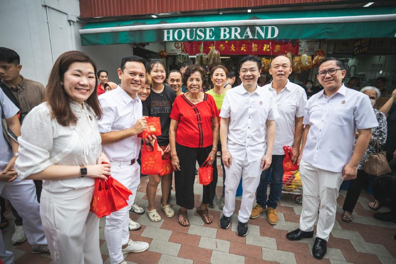 Sharing CNY wishes at Marsiling market …