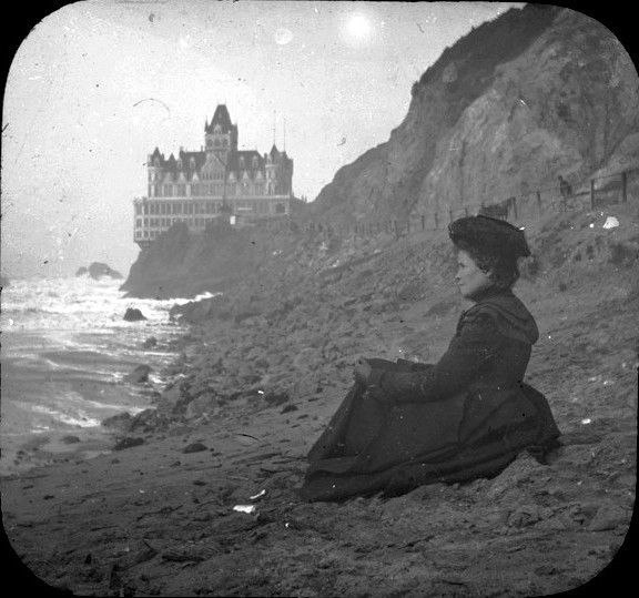 woman staring at the sea in …