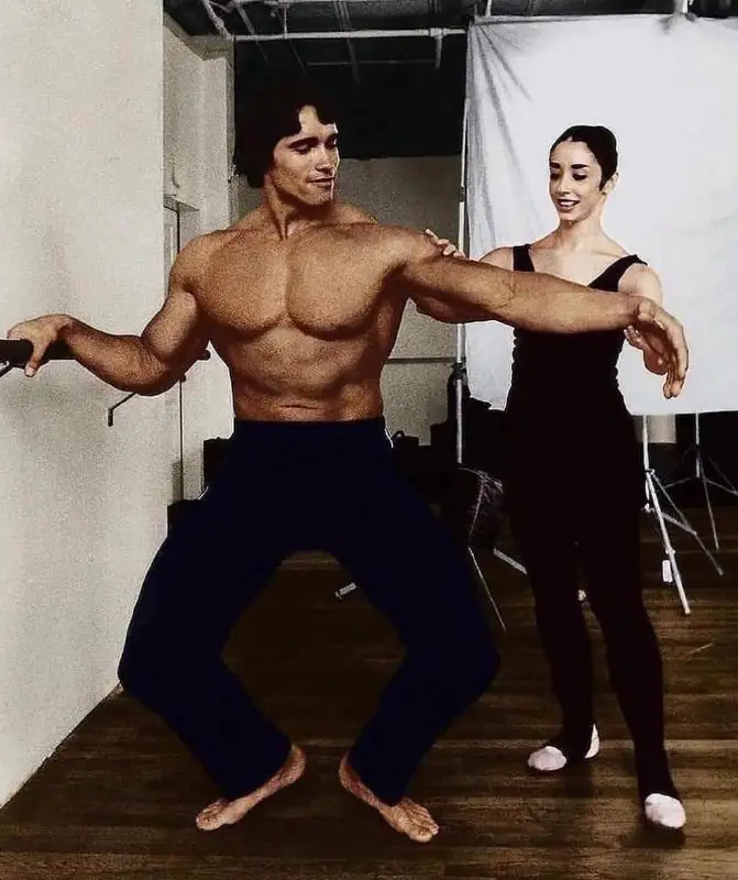 Arnold Schwarzenegger practicing ballet with a …